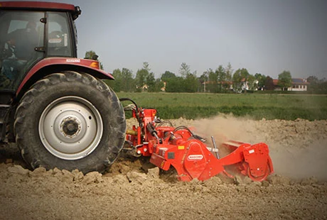 Cultivator in a ploughed field